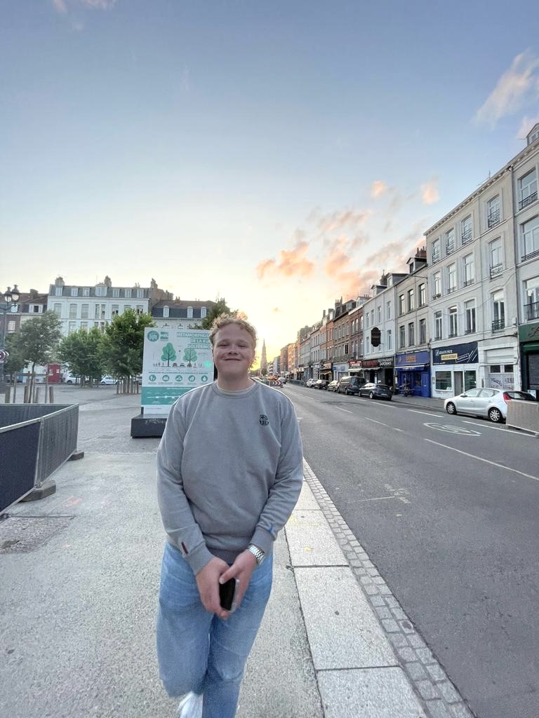 Klaas Brandwijk standing on a city street at sunset